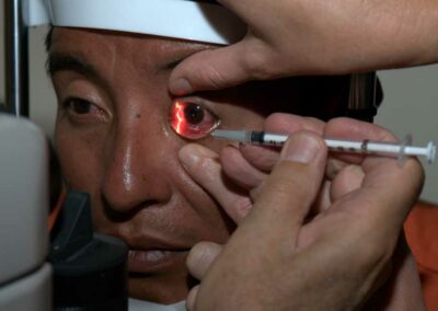 Man receiving eye medication