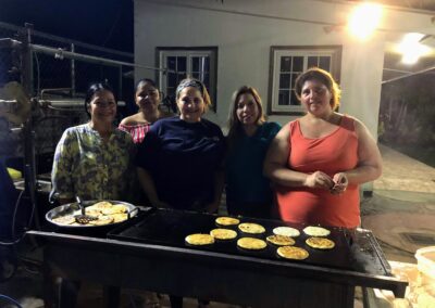 Women cooking on grill