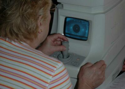 Woman using vision testing machine