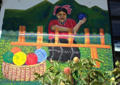 Mural of woman holding ball of yarn